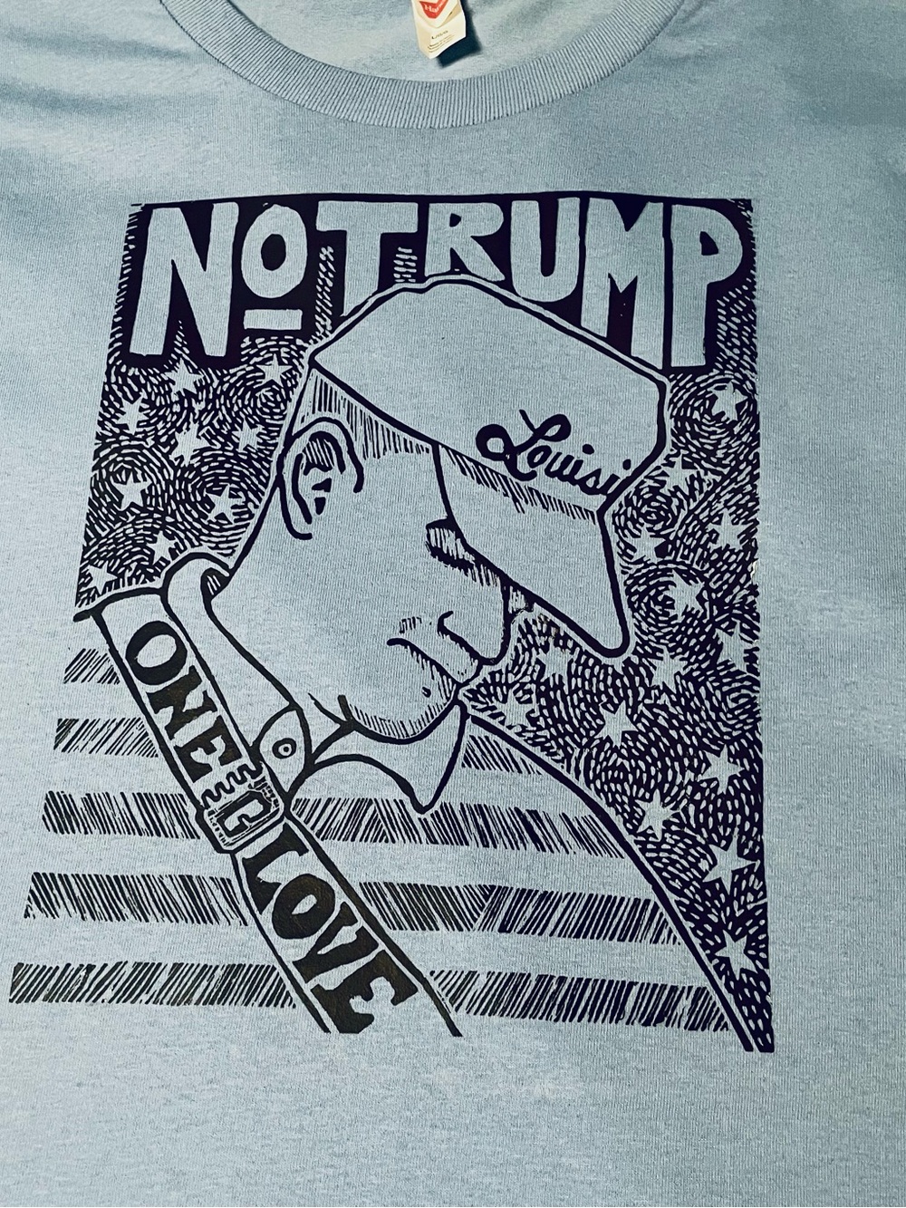 Light Blue 'No Trump One Love' Graphic Tee, for men and women. Multi sizes